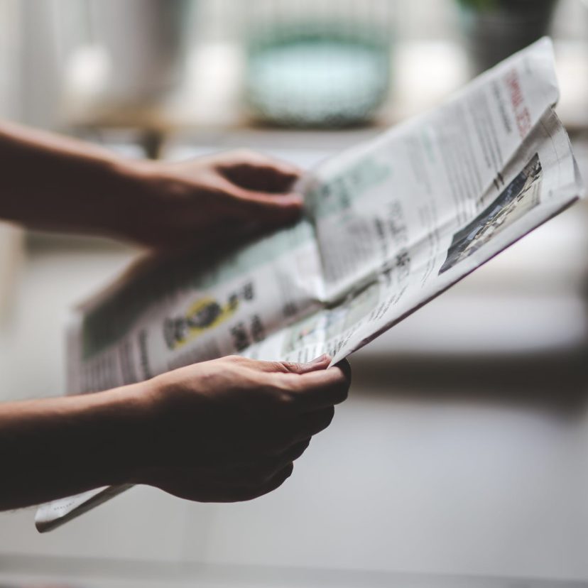 man reading newspaper